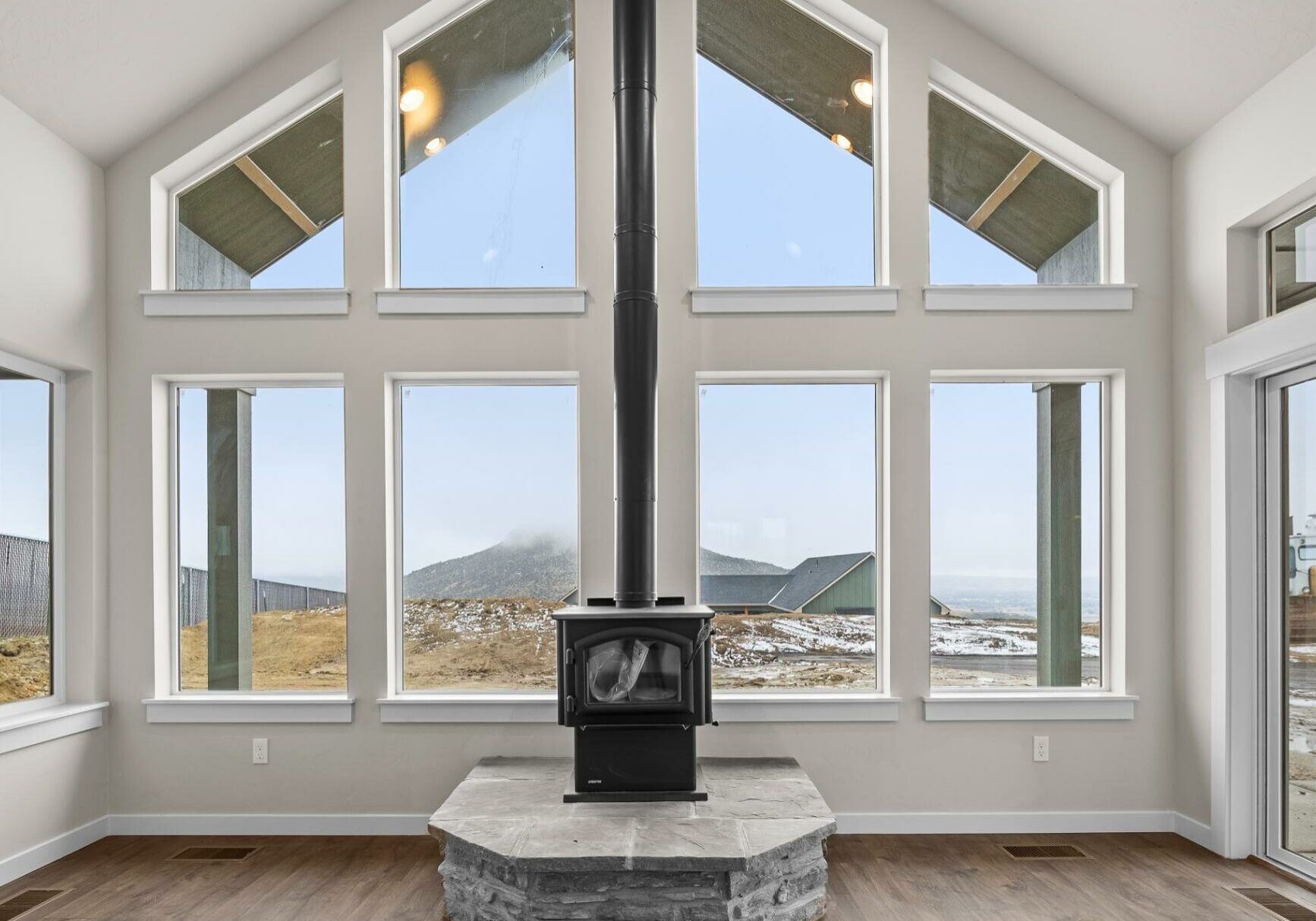 The Prairie Home Plan Family Room with Stove - One Bedroom House Plan - Pathway Builders