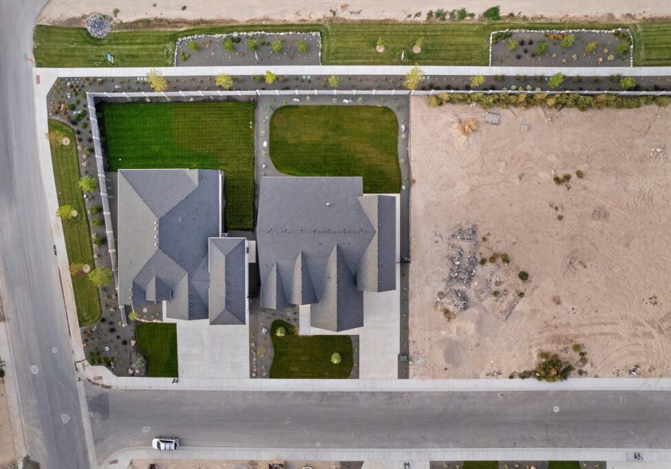 Aerial view of Preston Premier home development at 7168 E Chicken Hawk Loop showing modern residential architecture with landscaped yards.