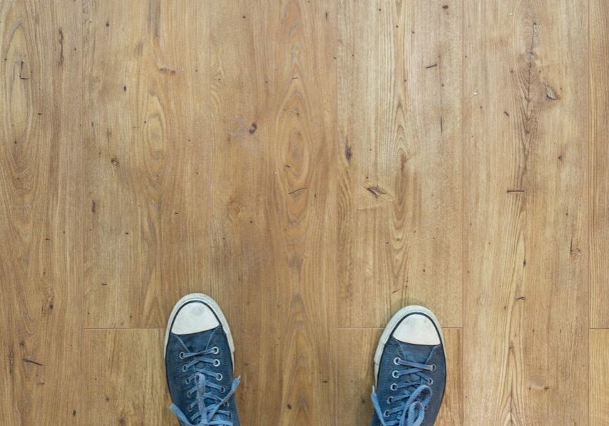 Choosing flooring for a new home thumbnail image person looking at flooring